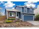 Charming two-story home with a well-kept front yard and a two-car garage at 325 Mulberry Cir, Broomfield, CO 80020