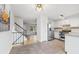 Bright kitchen features stainless steel appliances, neutral tile backsplash, and tiled flooring at 325 Mulberry Cir, Broomfield, CO 80020