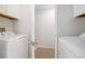 A small laundry room with a washer and dryer. Perfect for a compact space at 325 Mulberry Cir, Broomfield, CO 80020