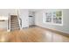 Open floor plan features hardwood flooring, neutral walls, and staircase at 325 Mulberry Cir, Broomfield, CO 80020