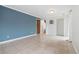 Empty living room featuring tile flooring, modern lighting, and neutral walls at 325 Mulberry Cir, Broomfield, CO 80020