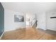 Open floor plan features hardwood flooring, neutral walls, and staircase at 325 Mulberry Cir, Broomfield, CO 80020