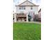 Spacious backyard with trampoline, slide, and swings offers ample room for outdoor activities and fun at 6236 S Millbrook Way, Aurora, CO 80016