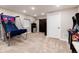 Recreational room showcasing an arcade game, basketball hoop, and cozy atmosphere for entertainment at 6236 S Millbrook Way, Aurora, CO 80016