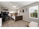 This bedroom features a wooden bed frame, neutral walls, and a ceiling fan for a cozy space at 6236 S Millbrook Way, Aurora, CO 80016