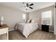 Cozy bedroom with neutral tones, a comfortable bed, and a bright window for natural light at 6236 S Millbrook Way, Aurora, CO 80016