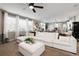 Open-concept living room featuring a large sectional sofa, modern decor, and seamless access to the kitchen at 6236 S Millbrook Way, Aurora, CO 80016