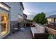 Relaxing outdoor patio with cozy furniture and scenic views of greenery and neighboring homes at 6236 S Millbrook Way, Aurora, CO 80016