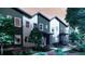 Modern townhomes with landscaped yards and inviting entrances in a residential neighborhood at 81 N Meade St, Denver, CO 80219
