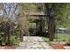 A charming garden path featuring an arbor-covered walkway to Cedar Park River Valley Gardens at 81 N Meade St, Denver, CO 80219