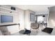 Comfortable living room with neutral tones, modern furniture, and a view into the dining area at 81 N Meade St, Denver, CO 80219