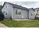 Exterior of the home showing the backyard and neutral gray siding at 11499 Kenton St, Commerce City, CO 80640