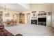 Spacious living area featuring a fireplace, dining table, and ample seating at 11499 Kenton St, Commerce City, CO 80640