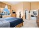 Serene bedroom featuring a closet, dresser, and a large window with neighborhood views at 11499 Kenton St, Commerce City, CO 80640