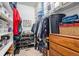 Organized walk-in closet with shelving, hanging racks, and storage containers for optimal space utilization at 11499 Kenton St, Commerce City, CO 80640