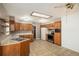 Kitchen with wood cabinets and stainless steel appliances at 406 Titan Ct, Aurora, CO 80011