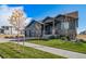 Gray house with two-car garage and well-maintained lawn at 23774 E 36Th Pl, Aurora, CO 80019