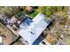 Aerial view of the property showcasing the home, gazebo, garden beds, and surrounding landscape at 6045 S Cook St, Centennial, CO 80121