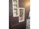 Stylish bathroom with built-in storage and a decorative mirror at 6045 S Cook St, Centennial, CO 80121