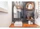 Stylish bathroom boasts modern fixtures, sleek vanity, and decorative wood and metal accents at 6045 S Cook St, Centennial, CO 80121