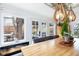 Light-filled dining area featuring a stone fireplace and an outdoor view to the pergola at 6045 S Cook St, Centennial, CO 80121