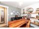 Home office space with floating shelves, sleek decor, and unique wooden desk at 6045 S Cook St, Centennial, CO 80121