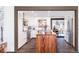 Modern kitchen featuring custom cabinetry, stainless steel appliances, and a wood-topped island at 6045 S Cook St, Centennial, CO 80121