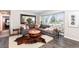 Cozy living room features a plush sectional sofa, hardwood floors, and a decorative area rug at 6045 S Cook St, Centennial, CO 80121