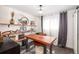 Stylish home office featuring custom shelving, contemporary desk, and bright natural light at 6045 S Cook St, Centennial, CO 80121