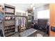 Organized walk-in closet features ample storage with custom shelving and a comfortable bench at 6045 S Cook St, Centennial, CO 80121