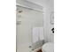 Bathroom showcasing a glass door shower, white tiled walls, and a toilet with modern fixtures at 1340 Deerpath Trl, Franktown, CO 80116