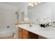 Well-lit bathroom featuring a vanity with a bathtub/shower combo at 1340 Deerpath Trl, Franktown, CO 80116