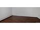 Bedroom featuring wood paneling and hardwood floors at 1340 Deerpath Trl, Franktown, CO 80116