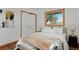Bedroom features a bed, closet, and a window at 1340 Deerpath Trl, Franktown, CO 80116