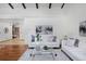 Bright and inviting living room with hardwood floors, comfortable seating, and lots of natural light at 1340 Deerpath Trl, Franktown, CO 80116