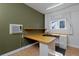 Office space with custom built-in desk and shelving at 1340 Deerpath Trl, Franktown, CO 80116