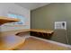 Office space with custom built-in desk and shelving at 1340 Deerpath Trl, Franktown, CO 80116