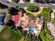 Estate aerial view showcases a tile roof, pool, tennis court and lush landscaping at 45 Charlou Cir, Cherry Hills Village, CO 80111