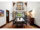 Elegant dining room with high ceilings, statement chandelier, and French doors leading to the outdoor space at 45 Charlou Cir, Cherry Hills Village, CO 80111