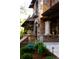 Beautiful stone facade with tile roof, stucco accents, and decorative columns at the entry of this luxury home at 45 Charlou Cir, Cherry Hills Village, CO 80111