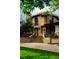 Stately stone home with meticulously maintained landscaping and front entrance at 45 Charlou Cir, Cherry Hills Village, CO 80111