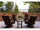 Inviting patio seating with a fountain and lush greenery offers a relaxing outdoor retreat at 45 Charlou Cir, Cherry Hills Village, CO 80111