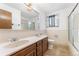 Double vanity bathroom with tiled floors at 3142 Uvalda St, Aurora, CO 80011