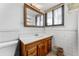 Bathroom with vanity, mirror, and tiled flooring at 3142 Uvalda St, Aurora, CO 80011