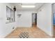 Kitchen with skylight, wood cabinets, and tile floor at 3142 Uvalda St, Aurora, CO 80011