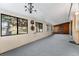 Sunroom with gray carpeting and multiple windows at 3142 Uvalda St, Aurora, CO 80011