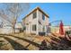 Backyard featuring a grass area, patio space, and the exterior of the home at 3829 Odessa St, Denver, CO 80249