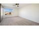 Bedroom with neutral carpet and large window for natural light at 3829 Odessa St, Denver, CO 80249