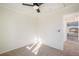 Bedroom with neutral carpet, ceiling fan, and view to attached room at 3829 Odessa St, Denver, CO 80249