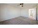 Bedroom with neutral carpet and open doorway to attached room at 3829 Odessa St, Denver, CO 80249